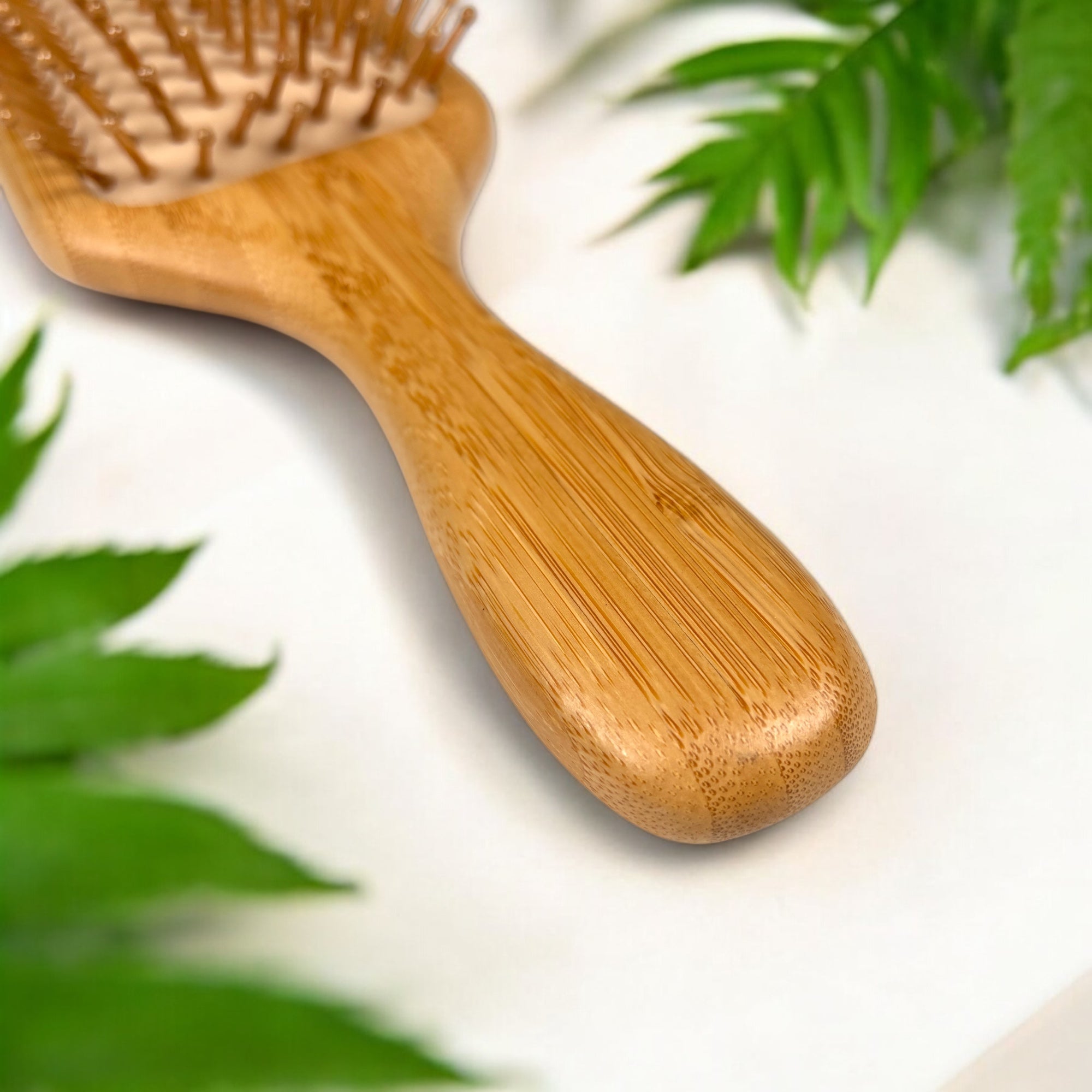 Handle close-up of bamboo comfort hair brush