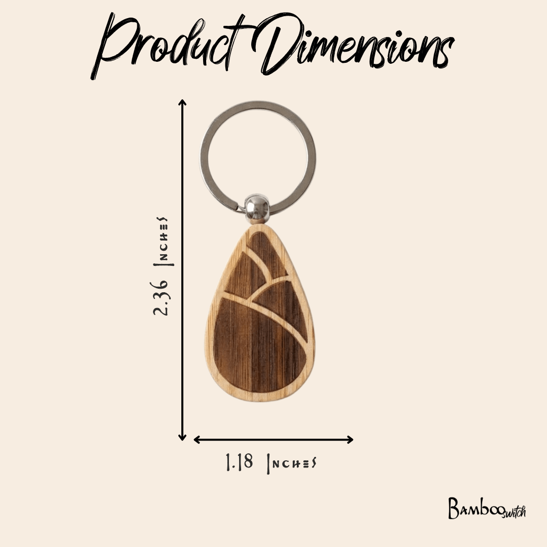 Bamboo keychains with teardrop design on a beige background showing dimensions.