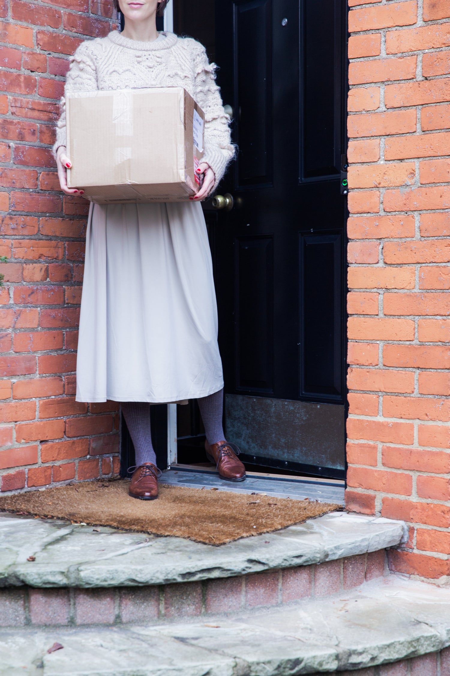 Woman holding Bamboo Switch shipping box