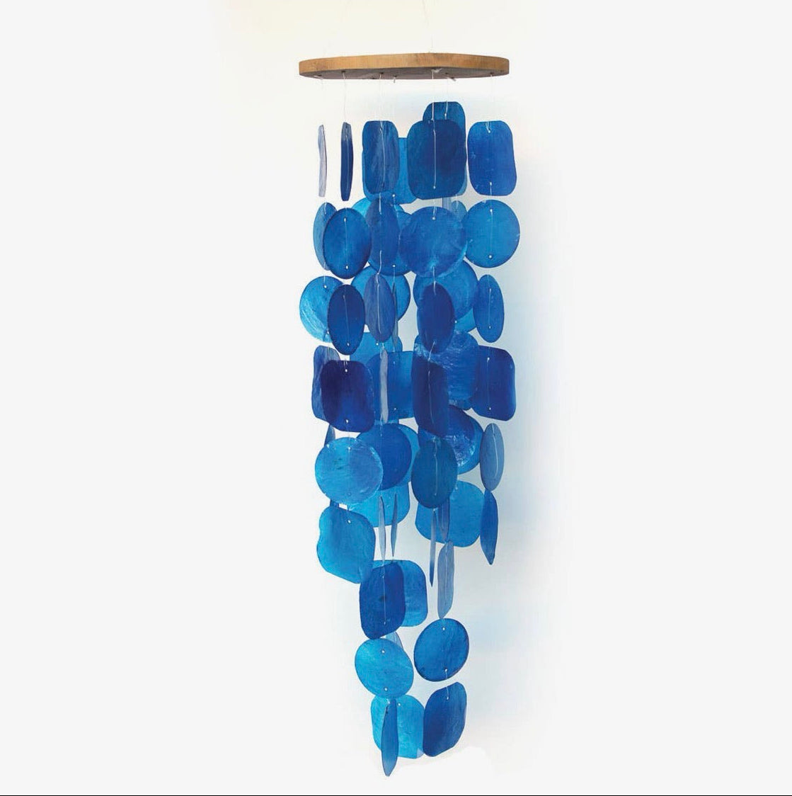 A modern ceiling-mounted wind chime featuring capiz shells, a natural wood top cap, and multiple hanging translucent blue capiz shells.
