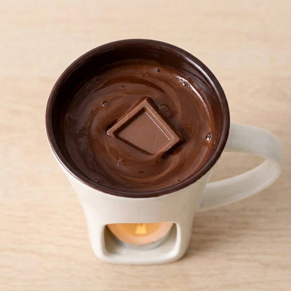 Mug with a chocolate interior and a square chocolate bar on a beige background
