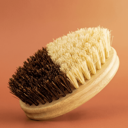 A multipurpose bamboo brush isolated against a pleasant, warm background | Bamboo Switch