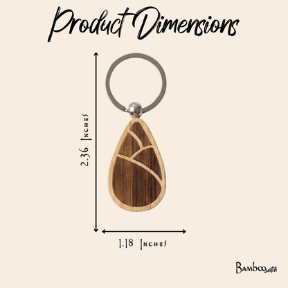 Bamboo keychains with teardrop design on a beige background showing dimensions.