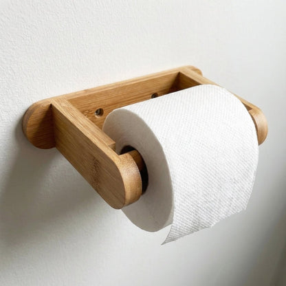 Bamboo Toilet Paper Holder holding bamboo toilet paper mounted to the wall | Bamboo Switch®