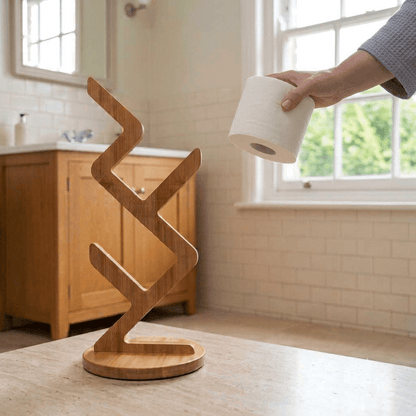 Empty zigzag bamboo toilet paper stand by bathroom window | Bamboo Switch