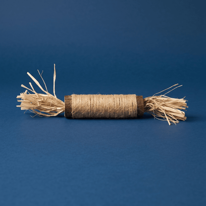 Twine and raffia cat chew toy on blue background | Bamboo Switch