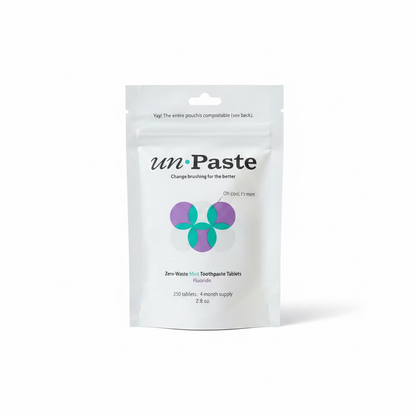 A white stand-up pouch of unPaste Toothpaste Tablets on a white background.